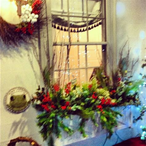 Make window box ideas spring to life, without water, using artificial flowers and plants. Porch window box with silk Christmas greens, holly, ilex ...