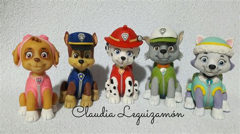 Five Small Figurines Of Dogs In Different Colors