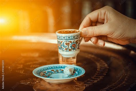 Woman Hand Holding Traditional Porcelain Turkish Coffee Cup Stock Photo