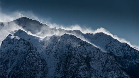 1366x768 Clouds Over Snow Mountain Range Cliff 1366x768 Resolution Hd