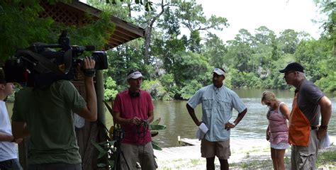 The Weather Channel's Paul Goodloe and Home Depot's Dave White filming