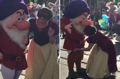 Snow White Attempts To Help Dwarf Pal Grumpy When His Pants Fall Down