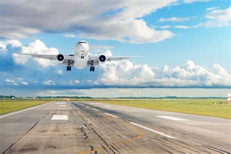 Passenger Plane Is Landing Runway From Airport Stock Image Image Of