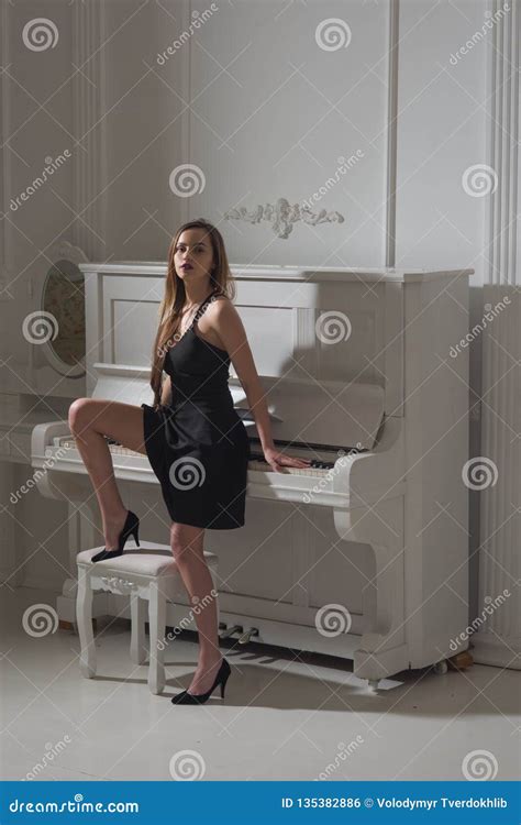 Woman In Elegant Coctail Dress Near Piano Elegance Concept Sensual