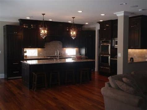 The classic blend is an espresso kitchen cabinet with white quartz tops and stainless steel appliances. Espresso Kitchen Cabinets with Wood Floors - YouTube