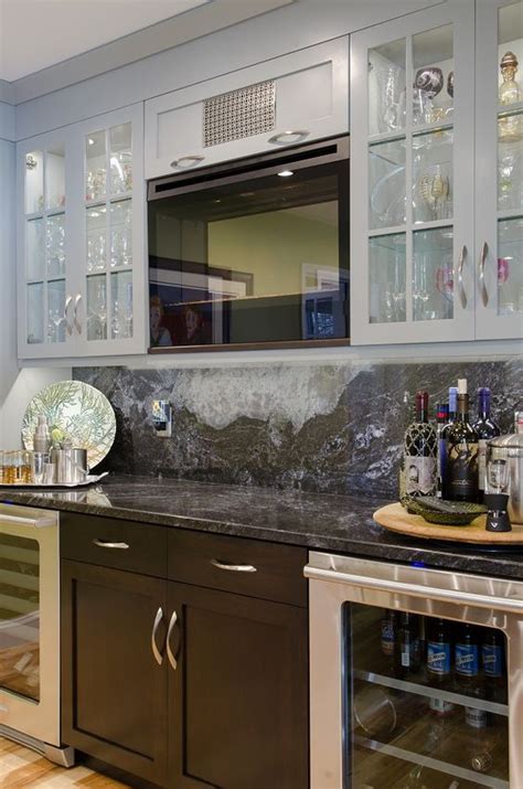 This kitchen features calcutta black quartz with a full height backsplash and waterfall edge on the island! Backsplash Ideas - full height granite baclsplash ...