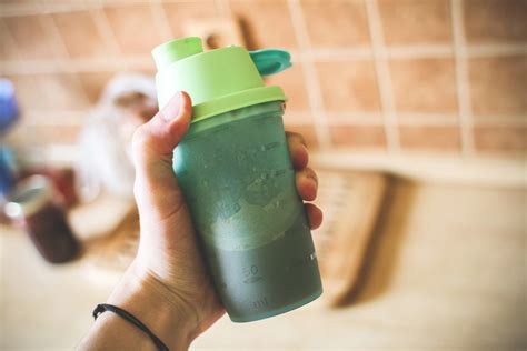 Fitness Man Holding Mass Gainer Protein Shake