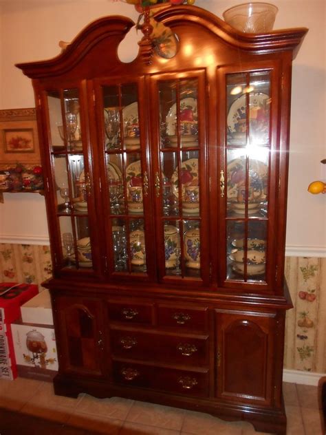 Bottom has a solid top wood trim behind glass with glass shelves.dark cherry or light mahogany. CHERRY WOOD CHINA CABINET--USED #Colonial | Cherry wood ...