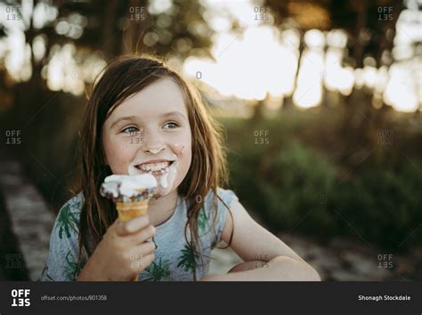 Happy Girl Eating Ice Cream Stock Photo Offset