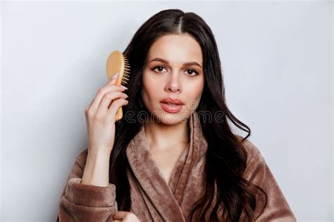 Brunette Woman Brushing Beautiful Healthy Long Hair With Brush Stock