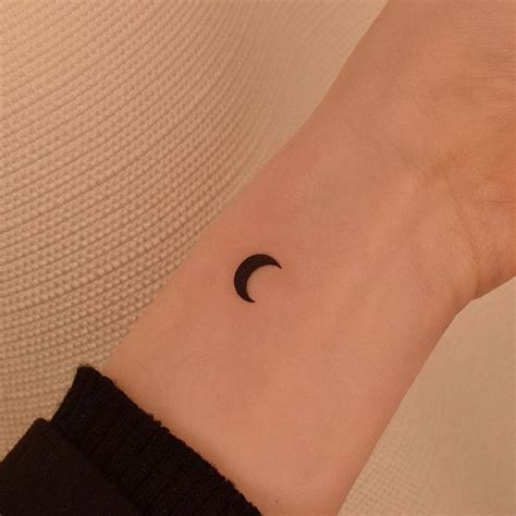 Minimalist Crescent Moon Tattoo On The Wrist