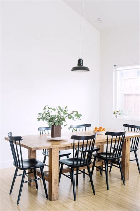 With its contoured x back and comfortable, carved seat, our vintner side chair supports you in all the right places. airy dining room, wood farmhouse table, black chairs ...