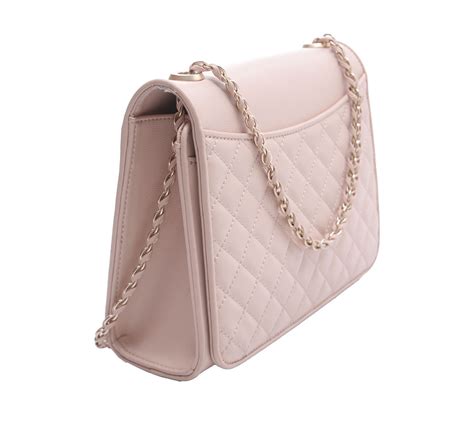 Black crossbody bag featuring a tassel detail and a magnetic closure. Charles & Keith Soft Pink Shoulder Bag