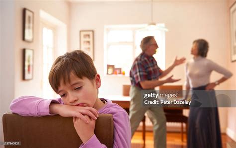 Sad Child Listening To Arguing Parents High Res Stock Photo Getty Images