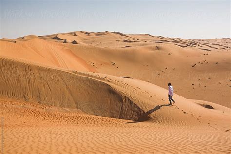 Man Walking Alone In The Desert By Stocksy Contributor Mauro