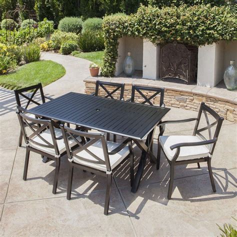 Transform your backyard into an elegant outdoor dining area with this 7 piece dining set with table umbrella and umbrella stand. Eowyn Expandable 7-9 Piece Outdoor Cast Aluminum Dining ...