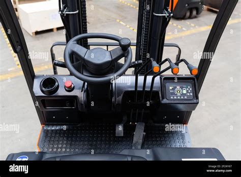 Detail of forklift cabin on warehouse. Industrial background Stock