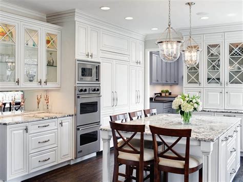 The blue and green backsplash enhances the room's coastal charm. White Traditional Kitchen Cabinets - TheyDesign.net ...