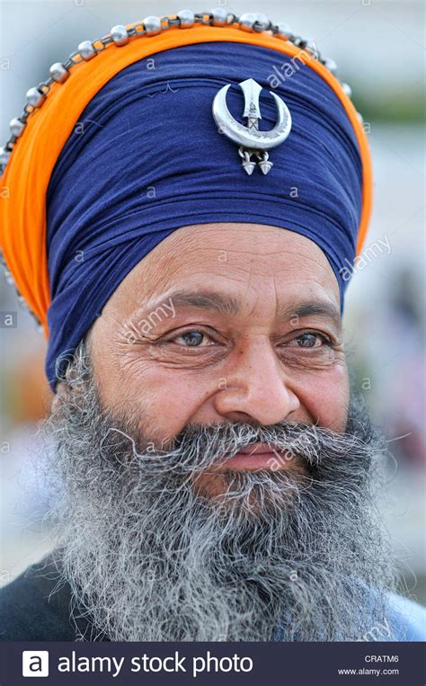Sikhism is known as one of the indian religions along with hinduism and buddhism, which we have sikhism accepts the hindu belief in karma and reincarnation but preaches a simple way of ending the. Sikh with Khanda emblem, symbol of Sikhism on turban ...