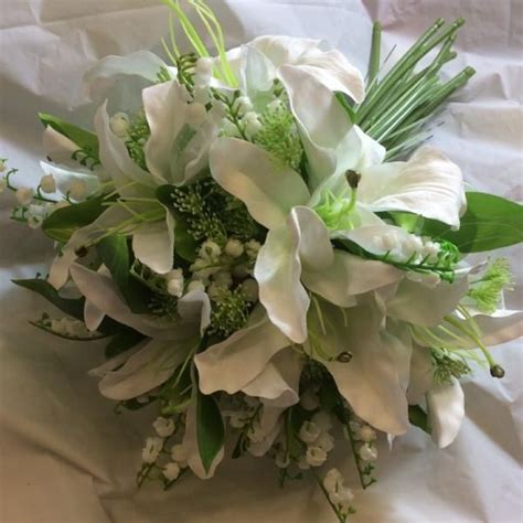 A Wedding Bouquet Of Artificial Lily Flowers Wedding Bouquets