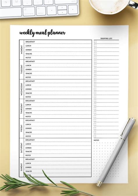 A Printable Weekly Meal Planner On Top Of A Desk Next To A Cup Of Coffee