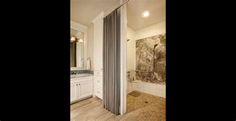 The customer uses a wheelchair and wants a curbless shower in a bathroom with a tiled floor. wheelchair accessible shower in bathroom by Garrison ...