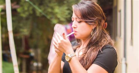 A Woman Smokes Cigarette Outside Stock Footage Video 100