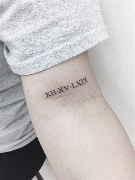 May 17, 2021 · the tattoo: Roman numerals on bicep tattoo #tattoo ideen datum Roman ...