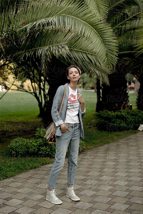 Pretty Woman Posing Outdoors By Stocksy Contributor Amor Burakova