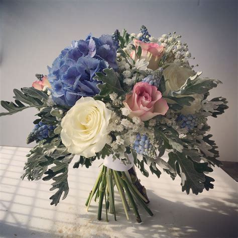 Bouquets of wedding flowers can cost anywhere from $80 to over $200. Blue, pink and Ivory Bridal/Bridesmaid bouquet with Roses ...