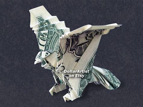 An Origami Bird Made Out Of Dollar Bills