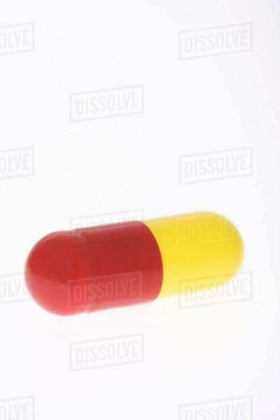 Red And Yellow Capsule Stock Photo Dissolve