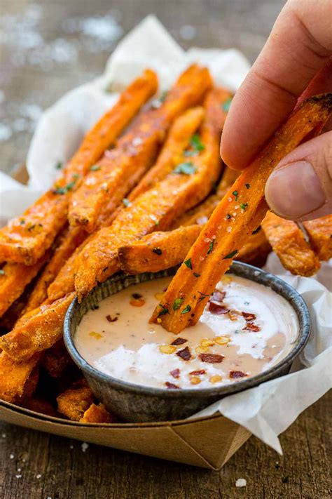Crispy baked sweet potatoes fries that are sweet, smokey and spicy paired with a bbq honey mustard dipping sauce! Baked Sweet Potato Fries - Jessica Gavin