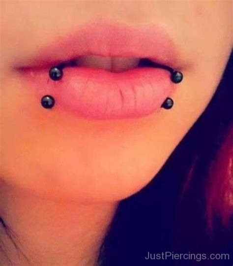 As snake bites piercing has two perforations, if one piercing becomes infected, the infection can spread to the other piercing, particularly if you can't refrain from touching the new jewelry. Snake Bites Piercing Close Up