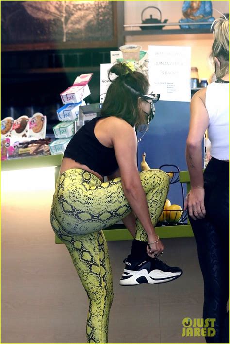 vanessa hudgens jumps around and playfully smacks pal gg magree s butt during store run photo
