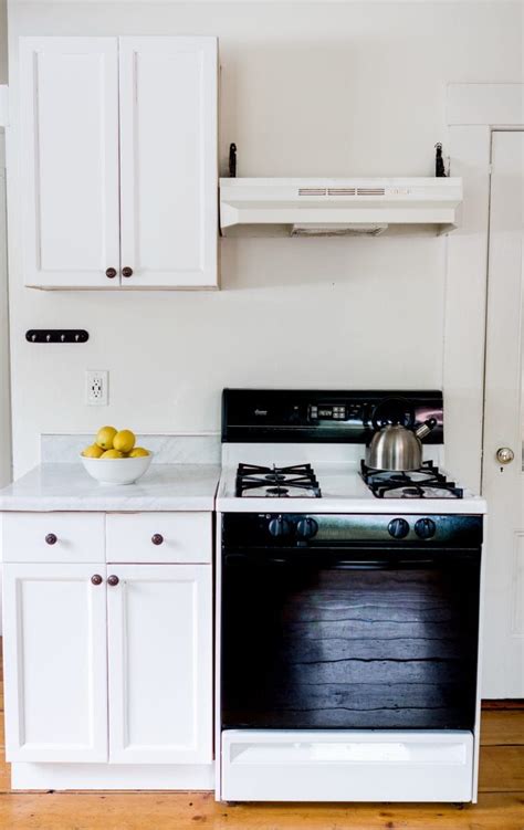You can opt for plain contact paper or select a wood grain finish to keep things cohesive. How to Make Over a Kitchen With Contact Paper: Covering ...