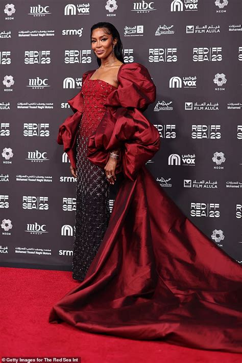 Naomi Campbell Exudes Elegance In A Red Gown With Statement Puff Sleeves As She Poses At The