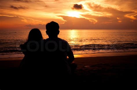 Couple Sitting On The Beach Stock Image Colourbox