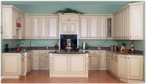Though this kitchen's range and cabinets are both white, one has brass hardware, while the other has silver. Cabinets for Kitchen: Antique White Kitchen Cabinets Pictures