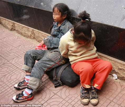 Young Chinese Twin Sisters Trussed Up On The Street By Their Father