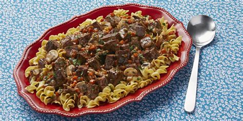 This family friendly beef stroganoff recipe combines tender browned bites of steak with onions, garlic, mushrooms and egg noodles in a rich creamy lightly seasoned beef sauce that has a touch of mustard and sour cream in it. Easy Beef Stroganoff Recipe - How to Make Beef Stroganoff ...