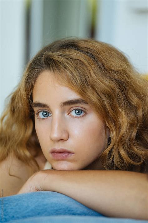 Portrait Of A Beautiful Girl With Wavy Hair And Blue Eyes By Stocksy Contributor Ivan Ozerov