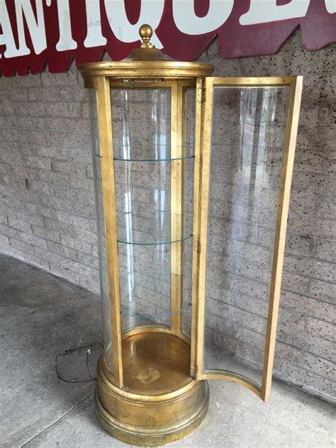 Models with a backed mirror and integrated lighting help emphasize every detail of your prized possessions. Vintage Gold Round Curio Cabinet Solid Wood With Working ...