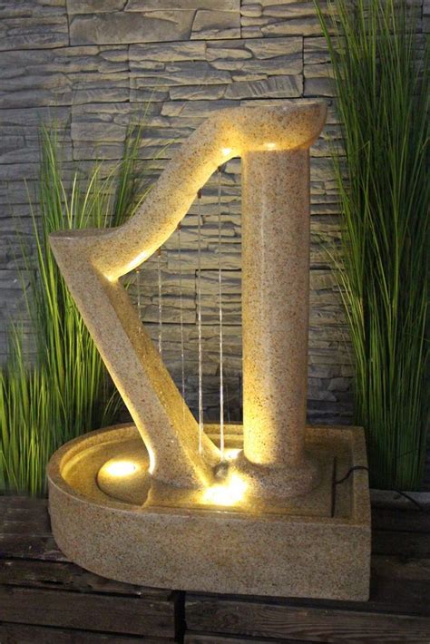 Je nach modell werden brunnen frei aufgestellt oder das wasserbecken ebenendig im. Gartenbrunnen Harfe Design Springbrunnen mit LED ...