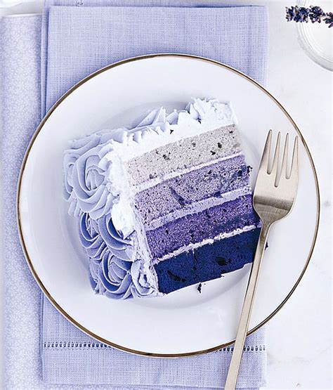 A Slice Of Cake Sitting On Top Of A White Plate Next To A Knife And Fork