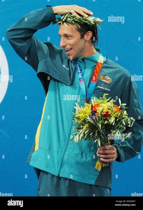 Dpa Australian Swimmer Ian Thorpe Adjusts His Laurel Crown During The Medal Ceremony After