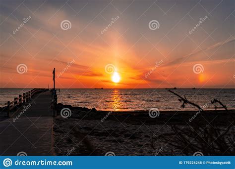 Red Sunset Over The Sea And Beach With Blurred Background Spring