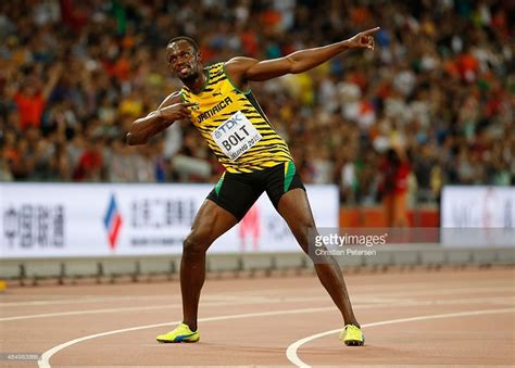 Usain Bolt Of Jamaica Celebrates After Winning Gold In The Mens 100