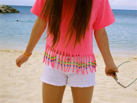 Put scotch tape across the shirt to keep your cuts even. I think this shirt with fringe and beads on the end is cute you could even do it as a crop top ...