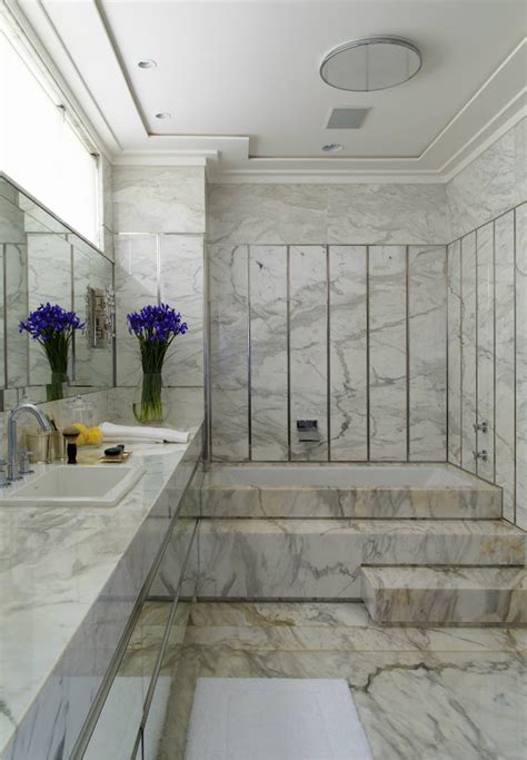 Lately, we've been lusting after marble bathroom floors. Marble Bathroom Designs to Inspire You
